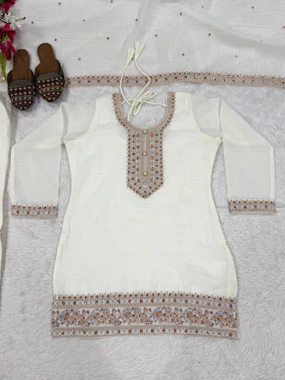 Pristine Ivory White Kurta and Palazzo Set Featuring Delicate Floral Embroidery, Sequined Borders, and a Matching Sheer Dupatta